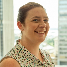 Head shot of Andrea Kargodorian. She is wearing a spotty top and smiling.