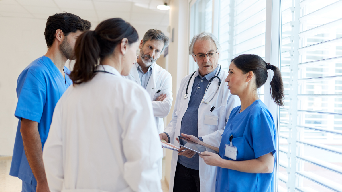 Photo of some health professionals in a clinic talking together.