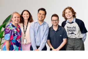 Five people from the Inclusion team standing together and smiling.