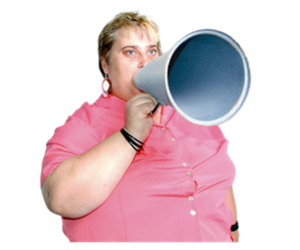 Photo of a woman speaking into a megaphone. She is wearing a pink shirt.