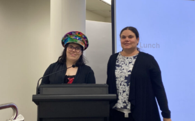 Two people giving a presentation at the roundtable.