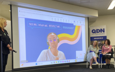 A woman giving a presentation at the roundtable.
