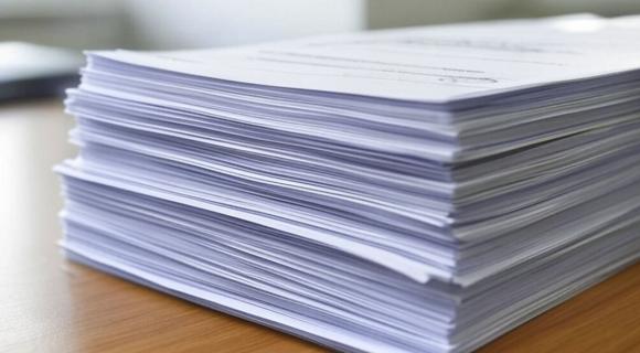 A pile of our submissions sitting on a desktop