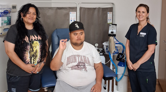 A photo of Maz Marley with his mum Natasha Bazil and Michelle Templeton from the Centre for Developmental Disability Health.