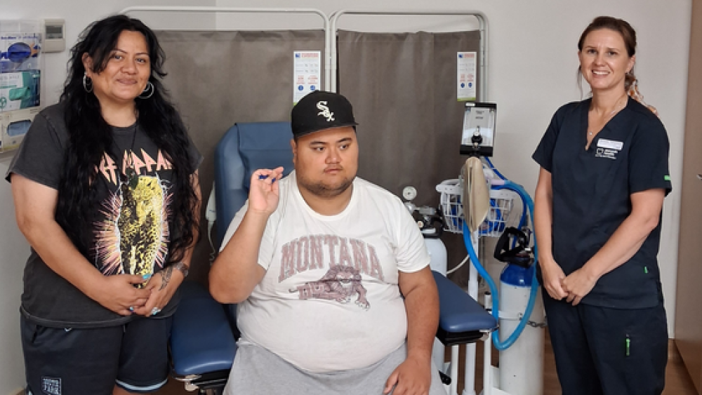 A photo of Maz Marley with his mum Natasha Bazil and Michelle Templeton from the Centre for Developmental Disability Health.