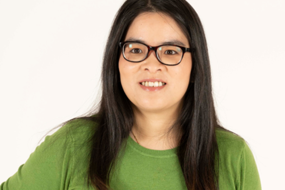 A photo of Ana Nguyen. She is wearing a green shirt.