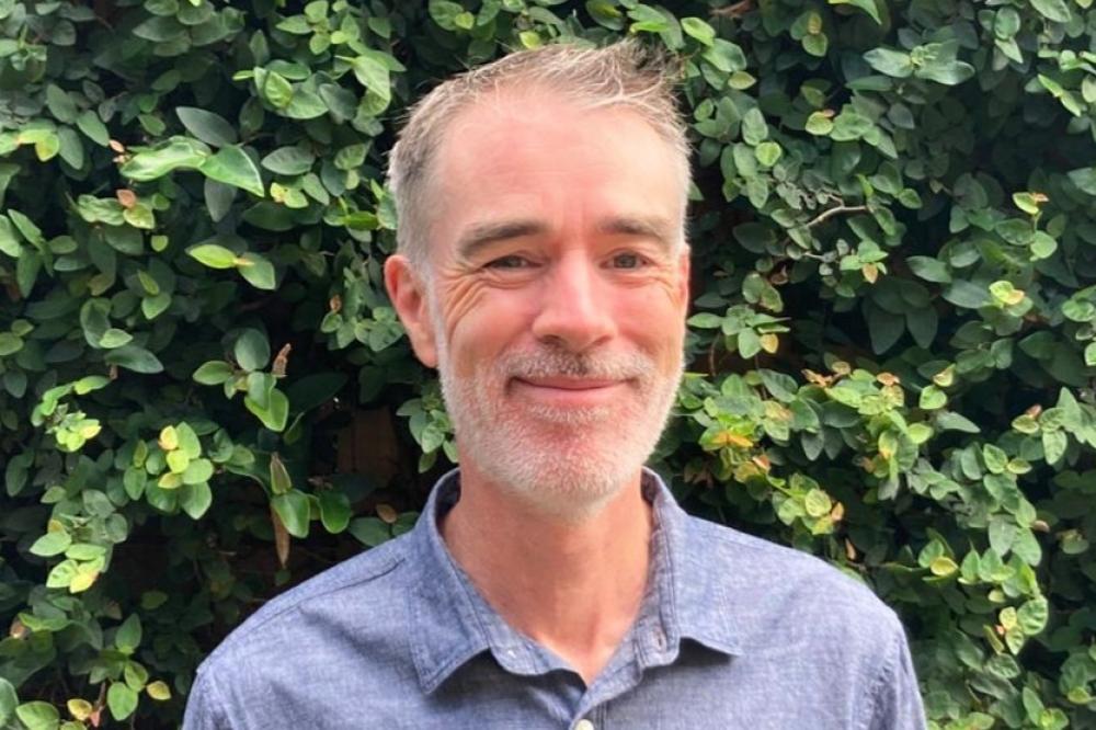 A head shot of James Cox.